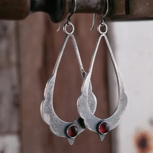 Vintage dangling earrings with red crystals